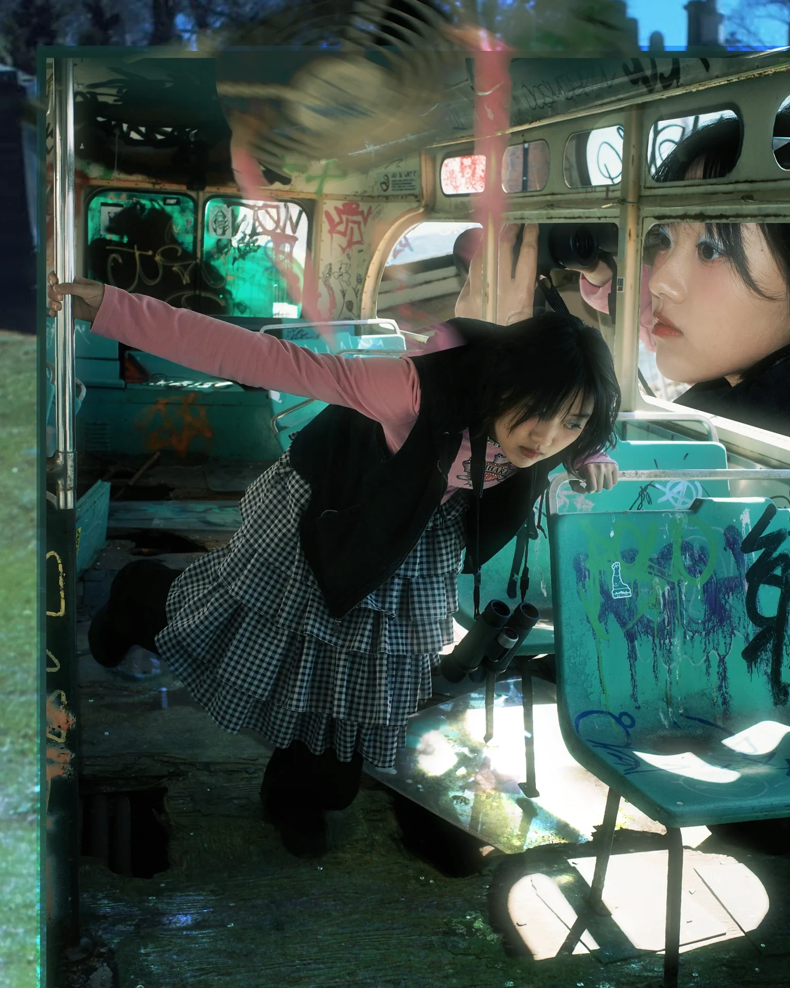 Photographic Studies — a portrait and layered reflections inside a graffiti-covered bus
